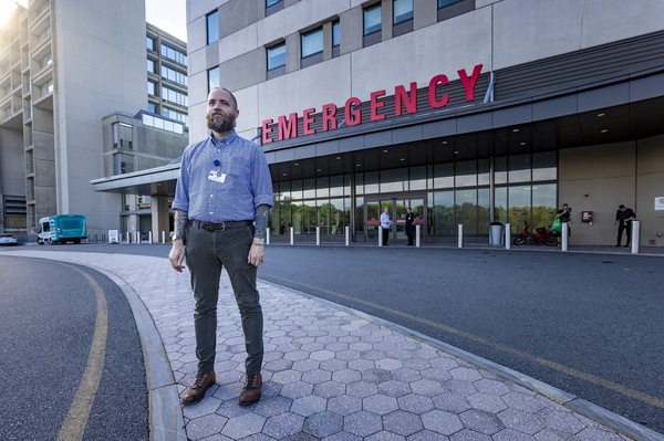 David Cave, a recovery coach who is part of an addiction specialty team at Salem Hospital, north of Boston, stands outside the emergency department.