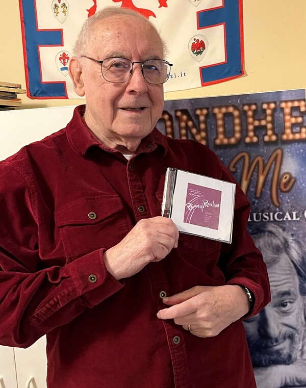 Journalist Paul Salsini holds the CD containing a rare live recording of Phinney's Rainbow. He found the CD while cleaning up his office.