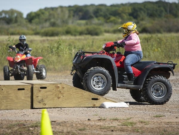 Elizabeth Finke negotiates an incline during a hands-on ATV safety class