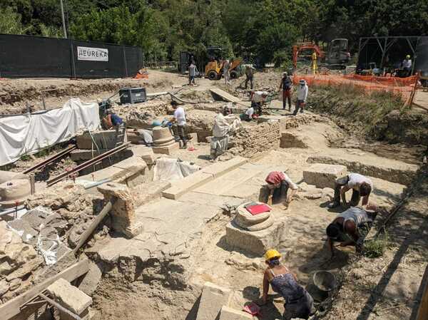 Archaeologists work at the site of an ancient thermal spring in San Casciano dei Bagni, Italy, on July 29.