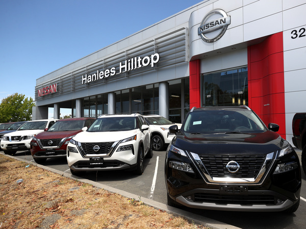 Brand-new Nissan vehicles sit on a sales lot in Richmond, Calif., on July 9, 2021. Car prices surged during the pandemic, and despite coming down from their peak, they still remain higher than a few years ago.