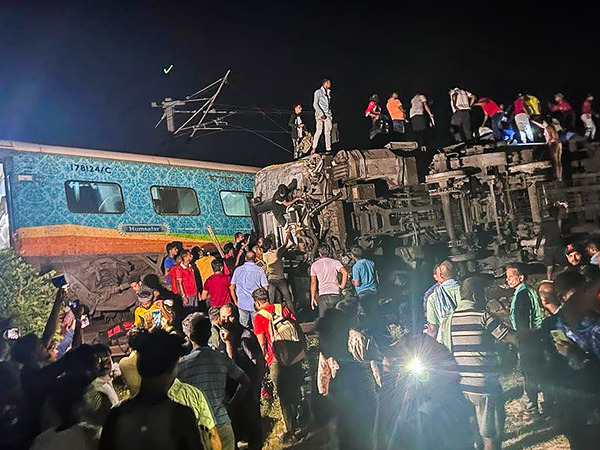 Rescuers work at the site of passenger trains that derailed in Balasore district, in the eastern Indian state of Orissa, on Friday.