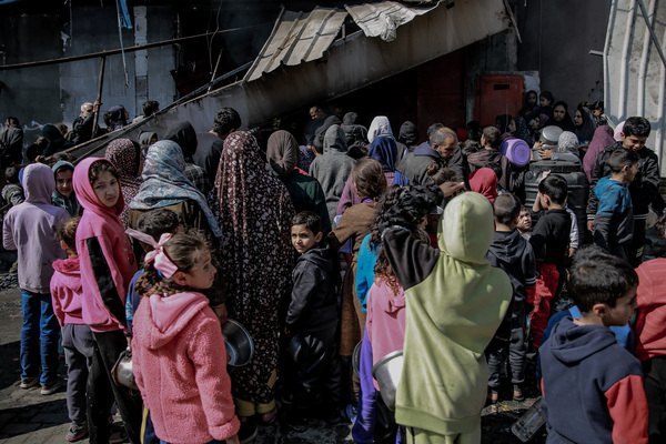 Palestinians in northern Gaza gather at a soup kitchen in Beit Lahia. The few soup kitchens in Gaza have long lines of people, mostly children, waiting to receive food. But supplies are limited, and many go away empty-handed.
