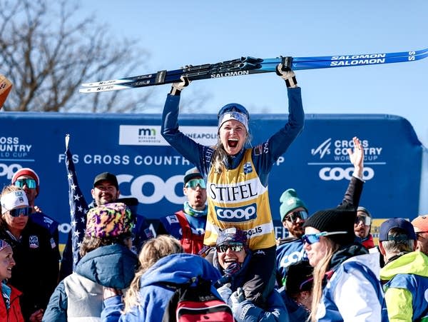 A cross-country skier celebates after a race