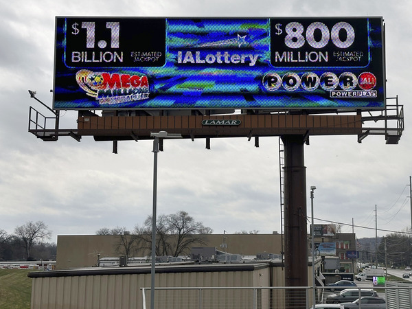An electronic billboard advertises the Mega Millions and Powerball jackpots, Monday, March 25, 2024, in in Des Moines, Iowa, that when combined amount to nearly $2 billion.