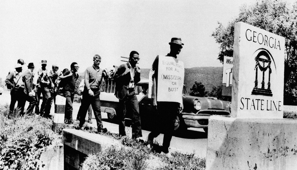 Civil rights activist Carver Neblett leads nine Freedom Marchers from Tennessee across the Georgia state line on May 1, 1963. The group retraced the route traveled by postal worker and civil rights activist William Lewis Moore, who was shot in Alabama on April 23, 1963.