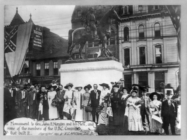 Members of the United Daughters of the Confederacy stand in front of a monument they commissioned of Confederate Gen. John Hunt Morgan and his men in Lexington, Ky., in 1911. The group has put up more than 600 markers and monuments to the Confederacy nationwide.