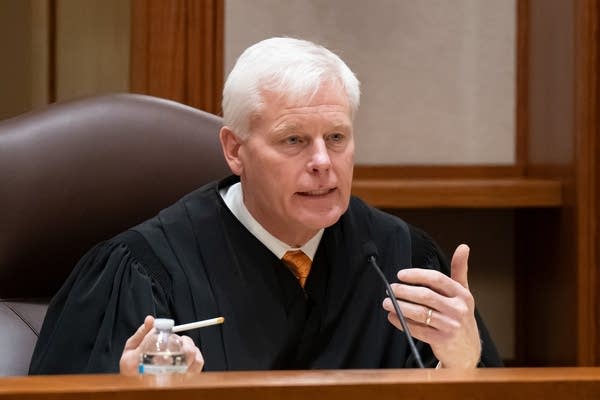 A judge listens to arguments during a court hearing.