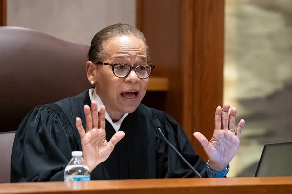 A judge asks questions during arguments in a court hearing.
