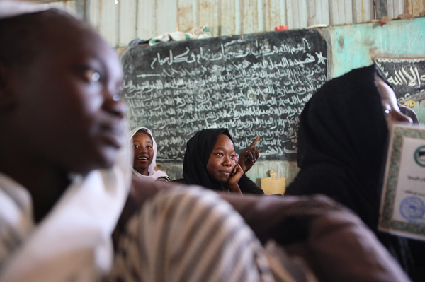 Displaced Sudanese sit in a classroom on Dec. 12, 2023.