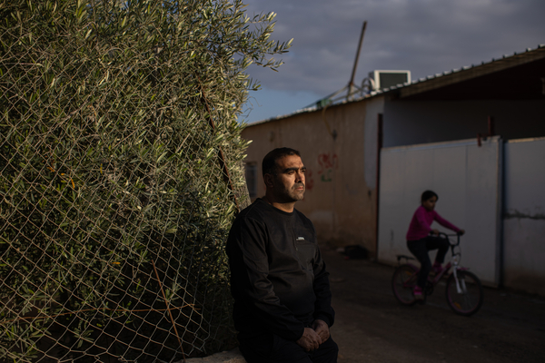 Mohammad Abu Queider stands near his home in al-Zarnuq, an unrecognized Bedouin village in southern Israel. His family has been caught in the crossfire twice: first during the Hamas attack and then in the Iranian strike.