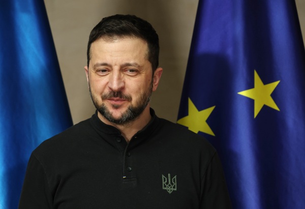 Ukrainian President Volodymyr Zelensky stands next to a flag of the European Union as he arrives to meet with German Chancellor Olaf Scholz at the 61st Munich Security Conference on February 15, 2025 in Munich, Germany.