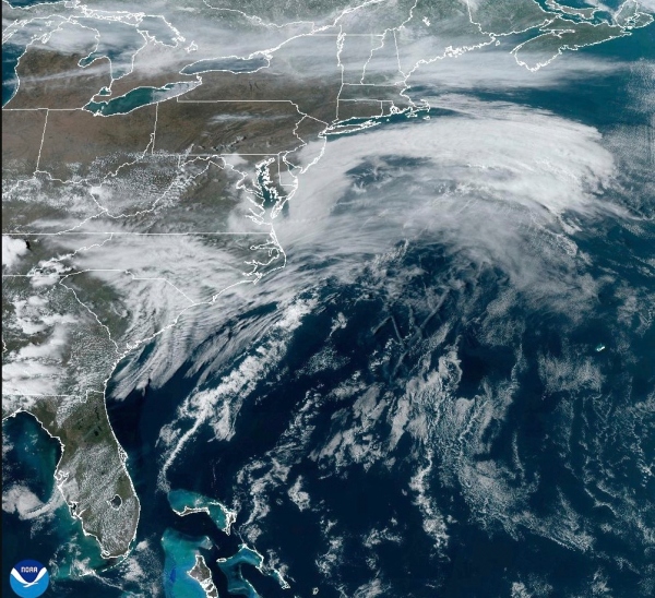 This satellite image from NOAA shows a March megastorm building across the United States on Thursday, March 13, 2025.