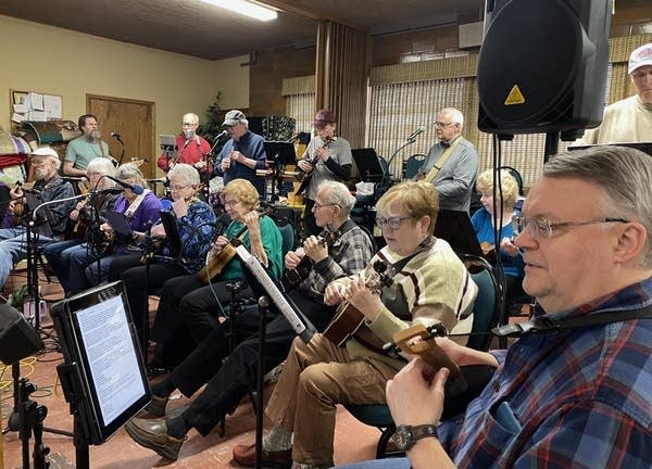 people playing ukulele 