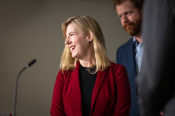 A woman speaks at a podium