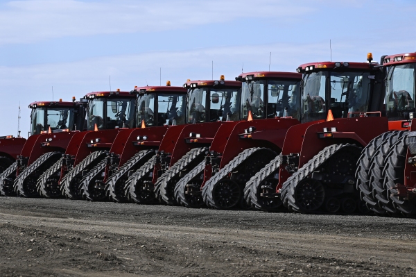 VALLEY CITY, ND - March 07, 2025: A row of new farm tractors on the sales lot of an implement dealer in Valley City, ND. North Dakota farmers are worried about looming tariffs and a possible trade war with China in the coming months.