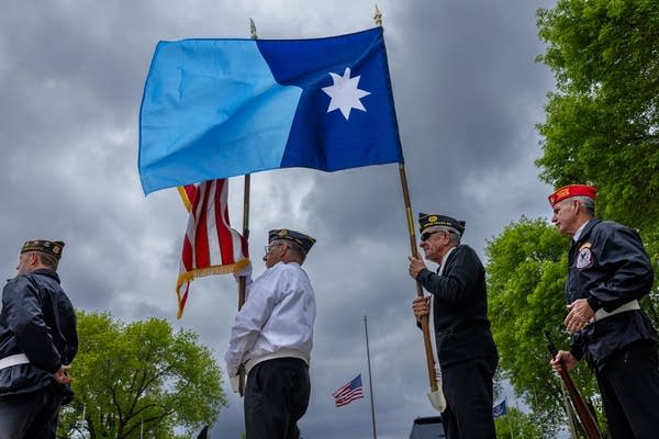 A person holds the new Minnesota state flag