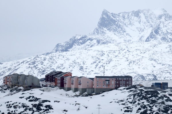 Homes are built into the rugged, snowy landscape in Nuuk, Greenland.