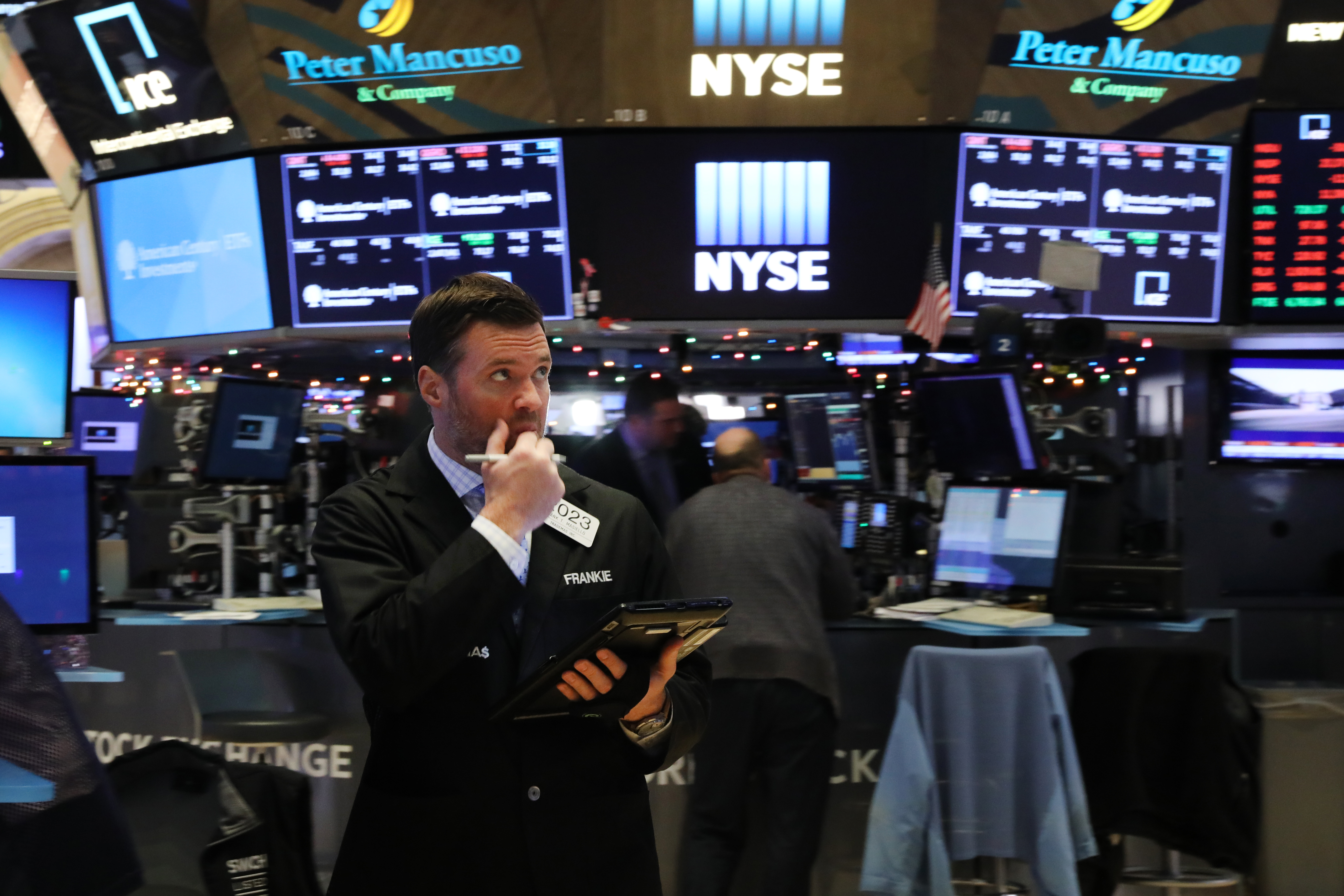 Stock traders look anxious on the floor of the New York Stock Exchange