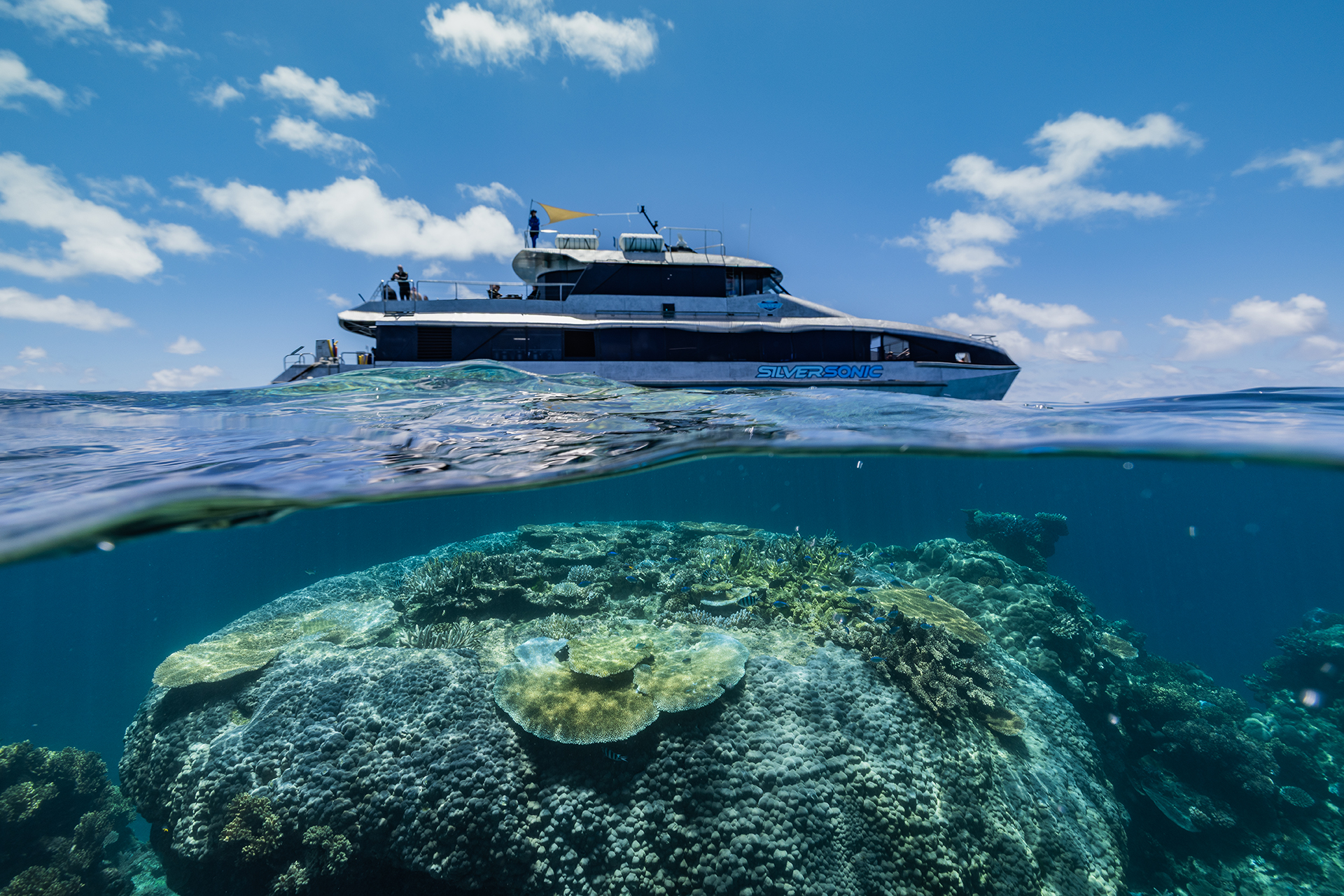 A dive boat above a coral reef