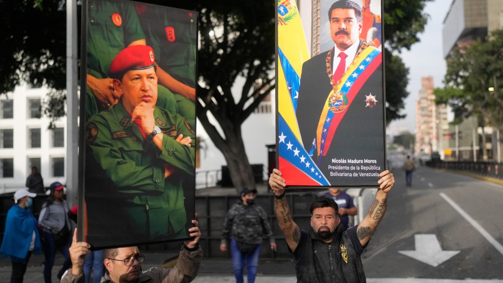 Government supporters display posters of Venezuelan President Nicolás Maduro, right, and former President Hugo Chávez in downtown Caracas, Venezuela, Saturday, Jan. 3, 2026, after U.S. President Donald Trump announced that Maduro had been captured and flown out of the country.