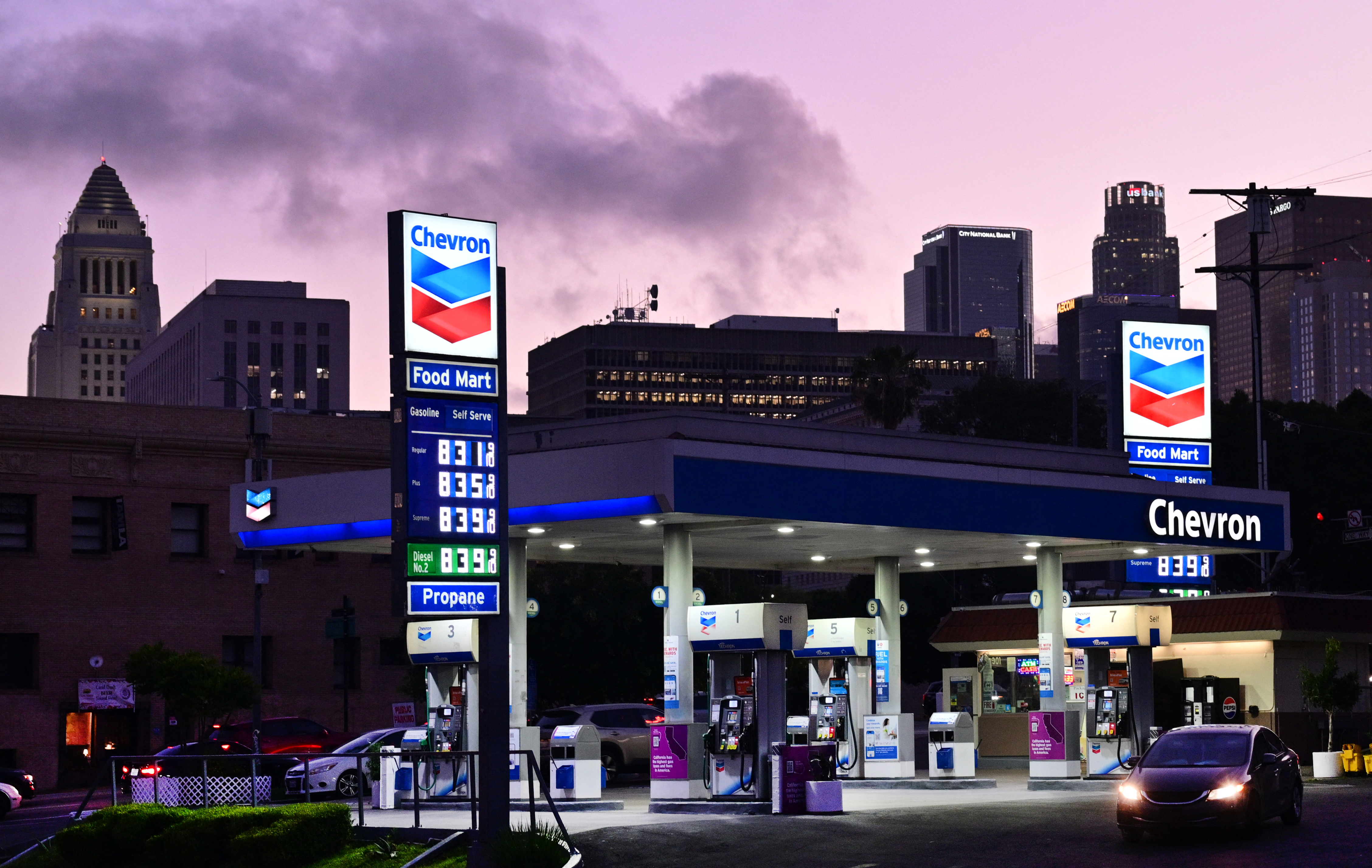 High gas prices are seen at a Chevron gas station in Los Angeles with city buildings in the background