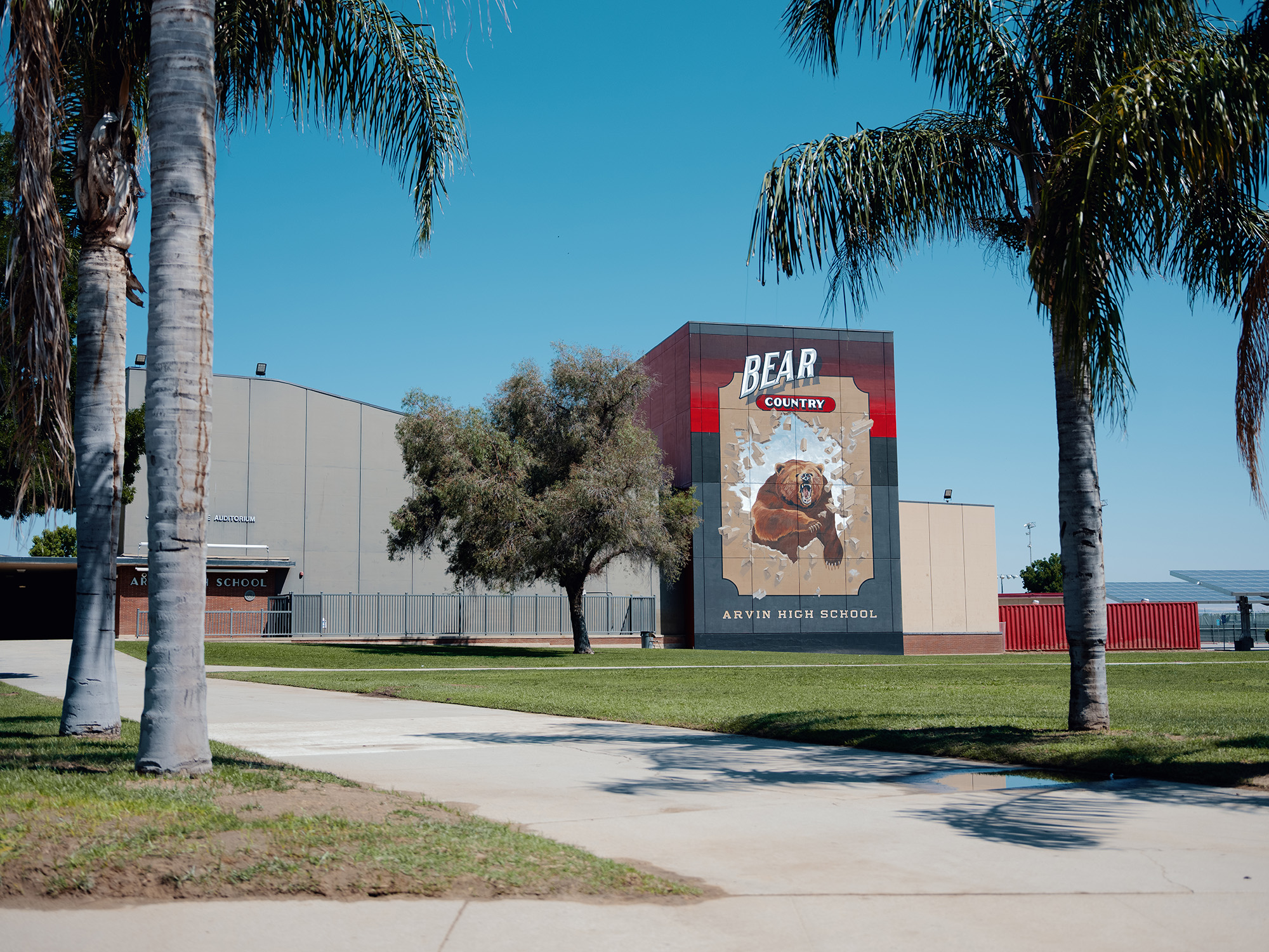 A high with large mural that reads, "Bear Country, Arvin High School."