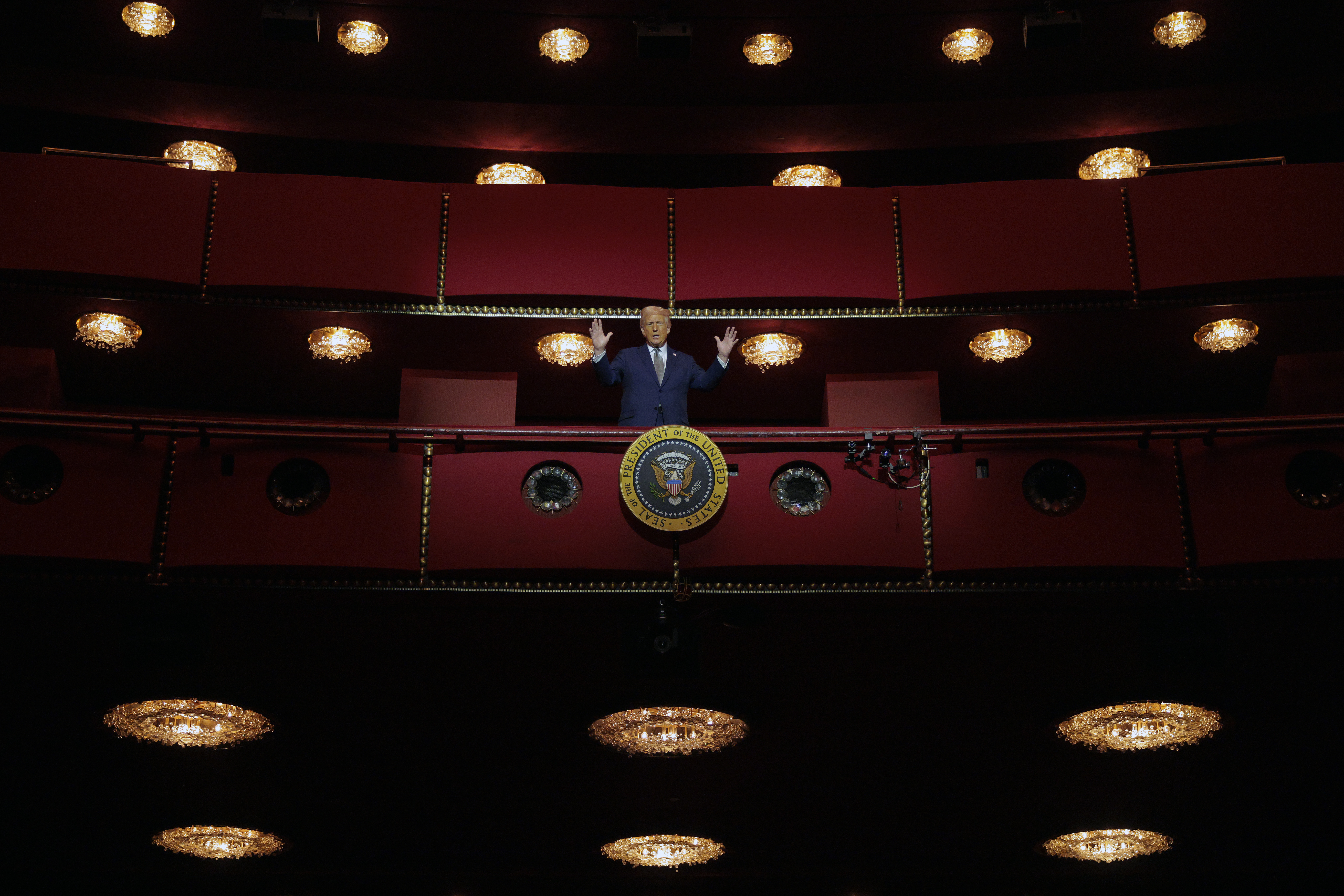President Donald Trump looks down from the Presidential Box in the Opera House at the John F. Kennedy Center for the Performing Arts.
