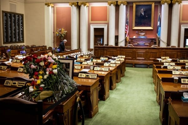 roses on a desk in the house chamber