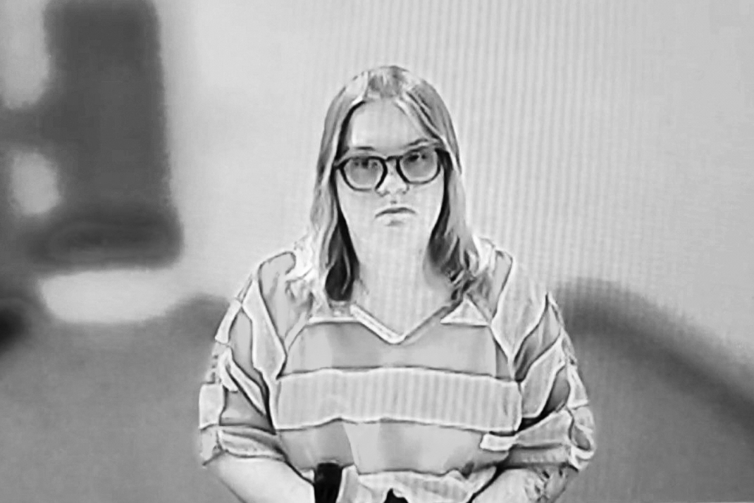 A woman in jail-house garb.