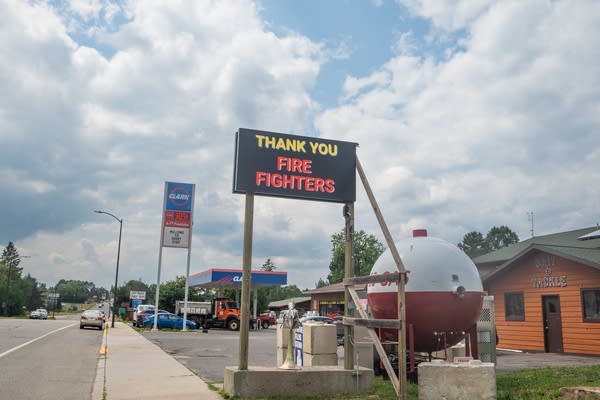 An electronic sign on the side of the road reads, 