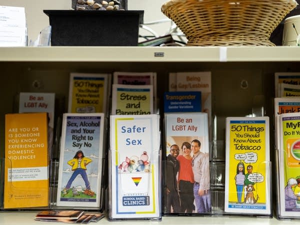 Educational pamphlets sit on a shelf