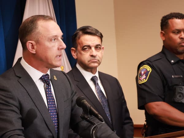3 men announce charges at presser