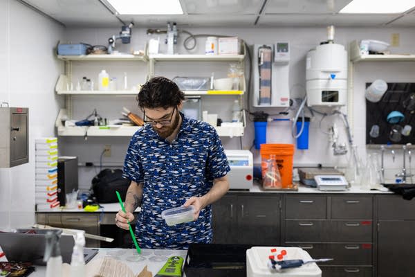 A man prepares samples in a lab