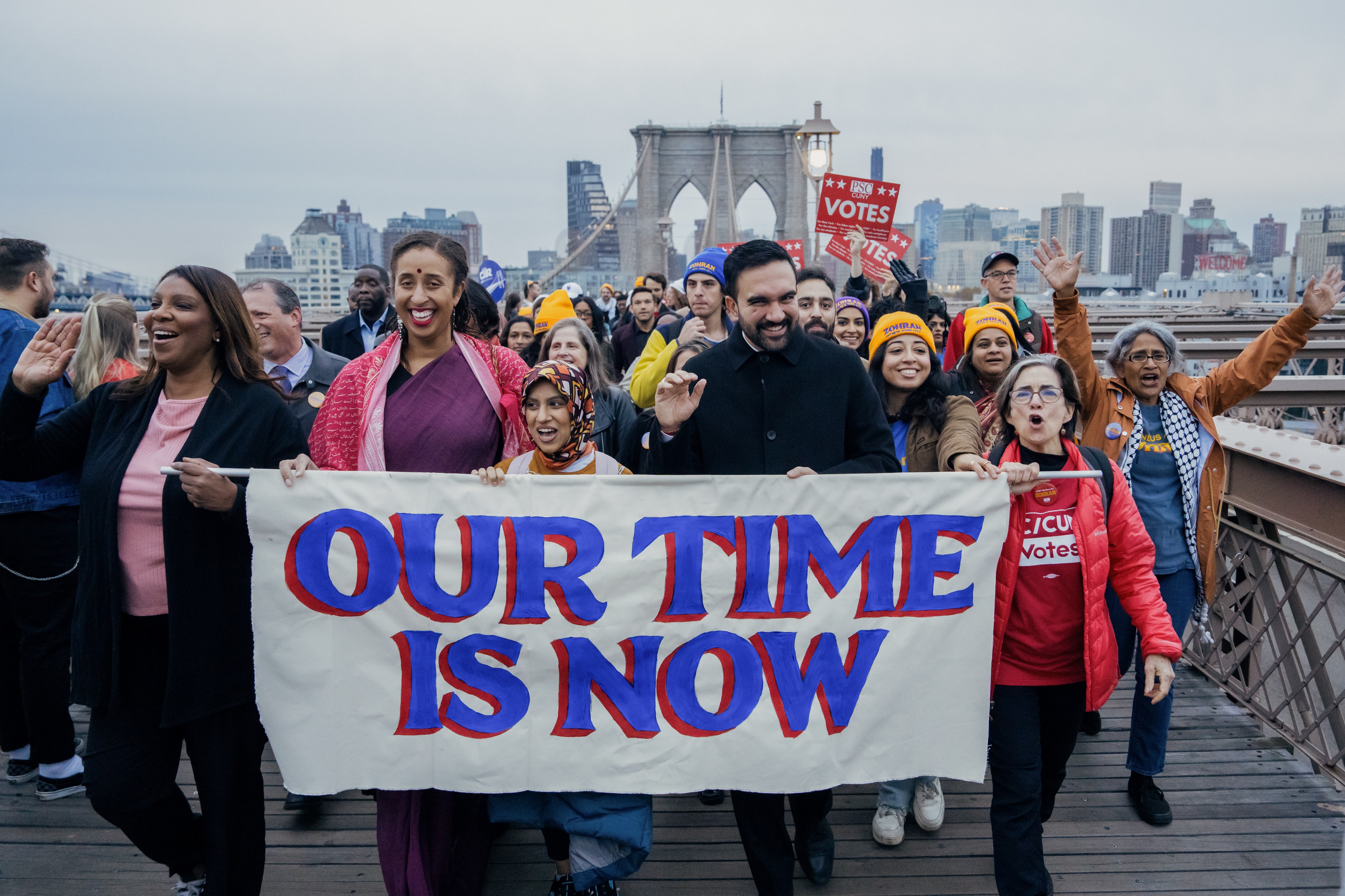 Mamdani and Letitia James hold a sign that reads Our Time is Now