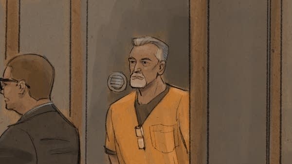 defendant appears in glass booth