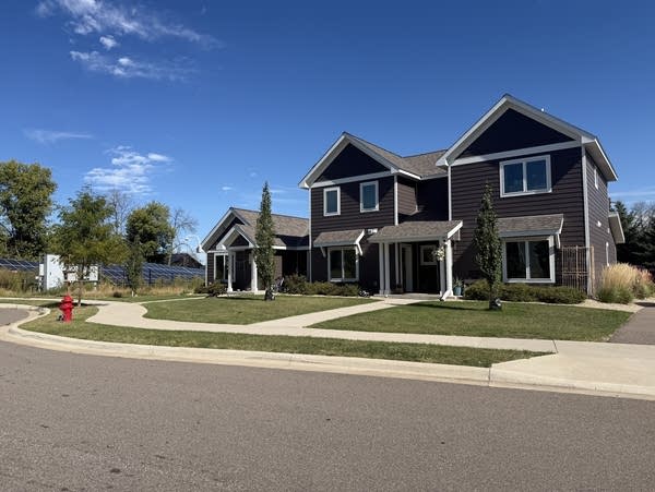 Wide shot of a house on a suburban street.