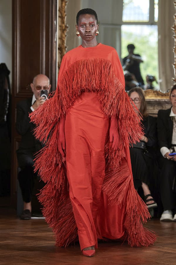 A model in a red dress