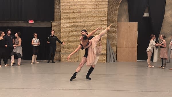 Two people dance