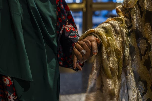 two people holding hands
