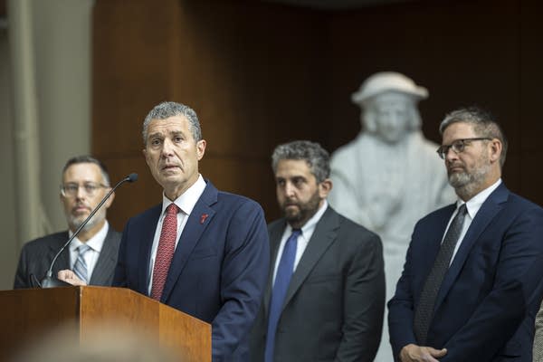 Antonio Romanucc speaking at a news conference 