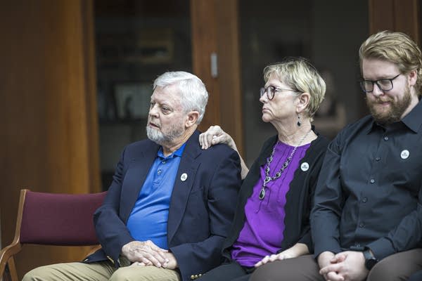 Renee Good’s parents sit with a family member 