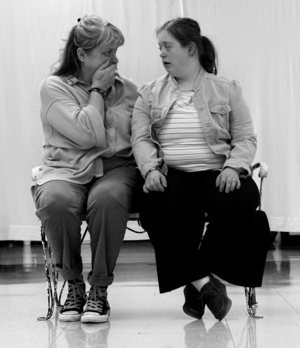 Two actors perform, captured in a black and white photograph.