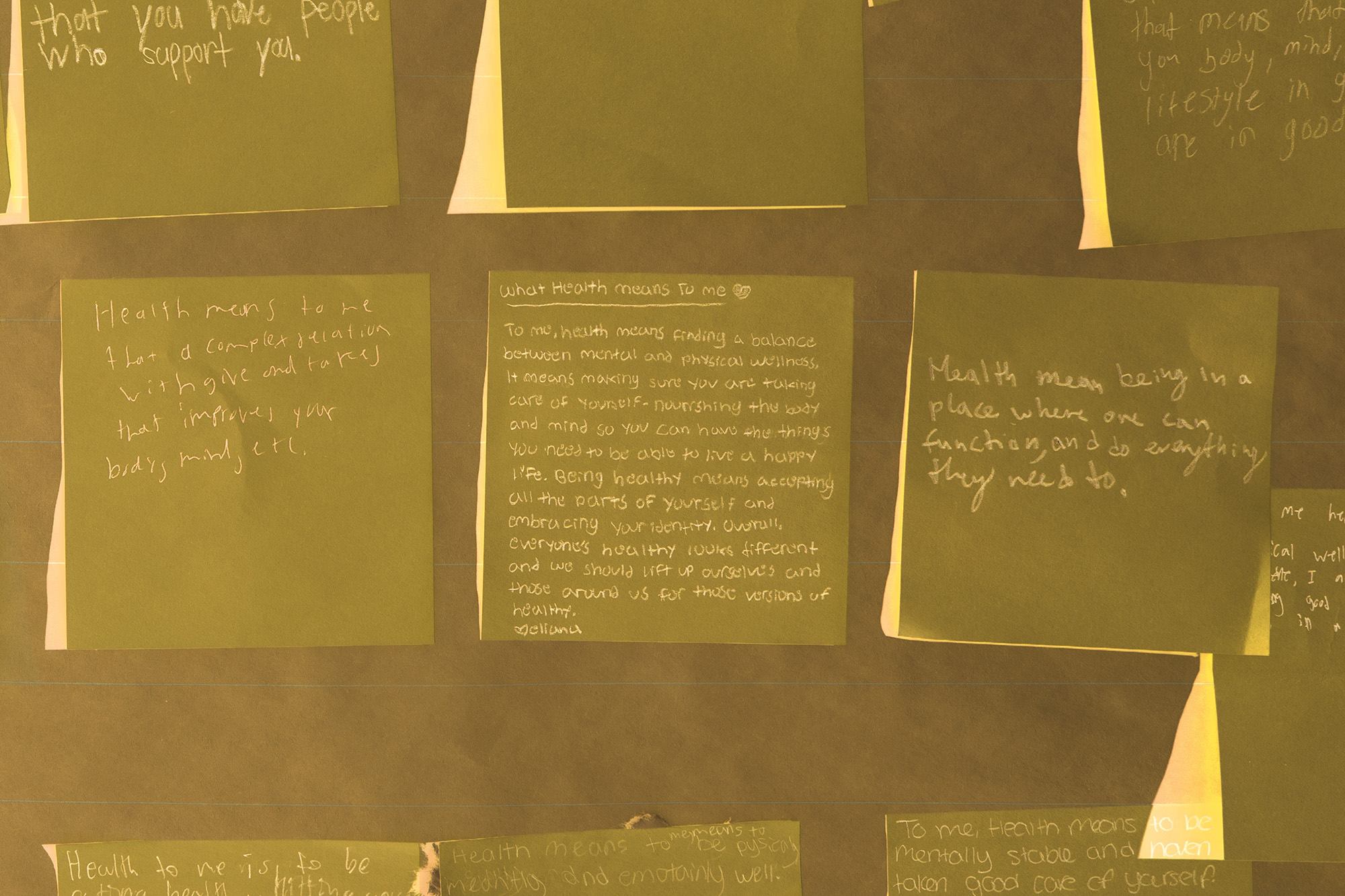 Post-Its answering the question, “What does health mean to you?”