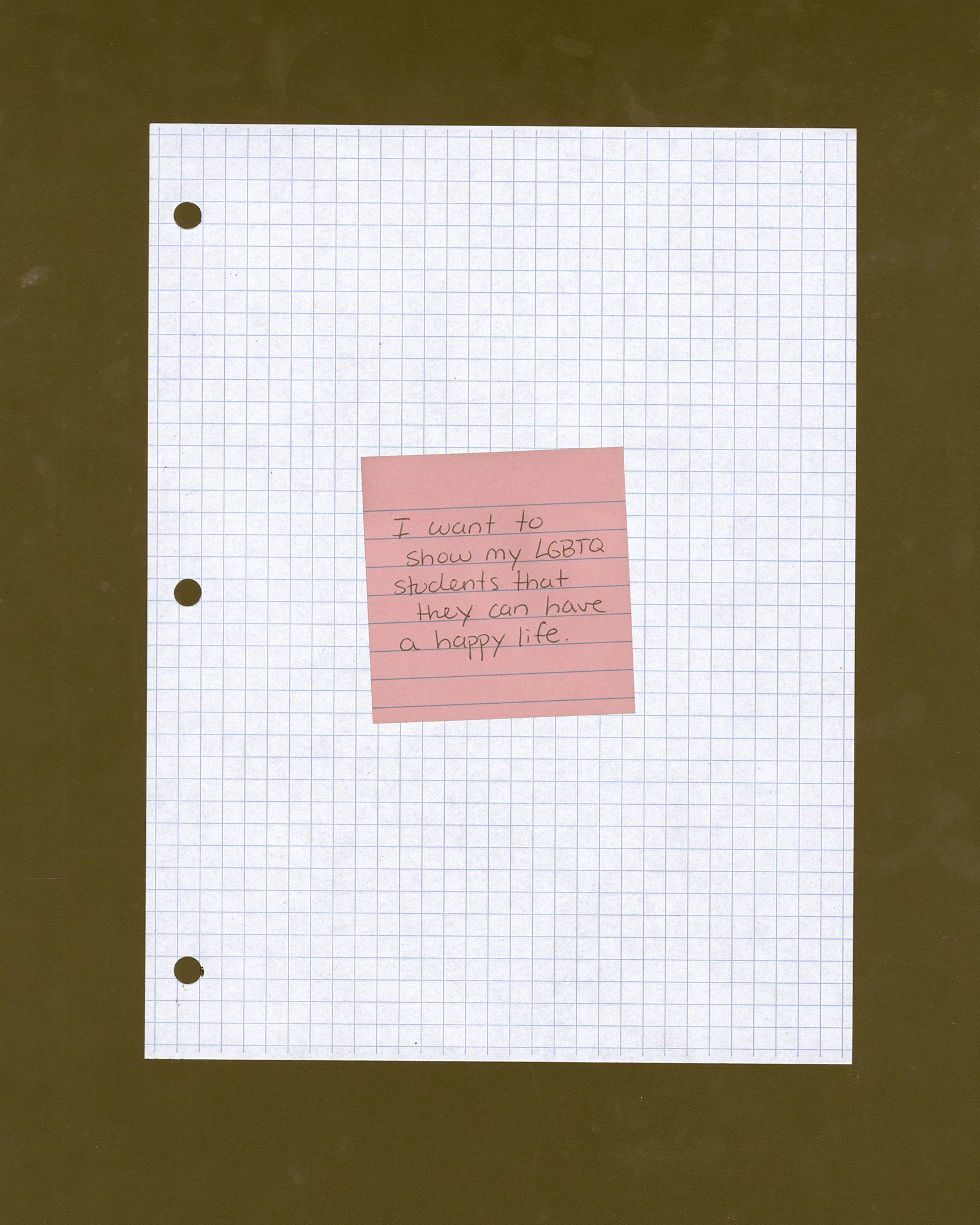 Grid paper with a pick Post-It Note with "I want to show my LGBTQ students that they can have a happy life" written on it. 
