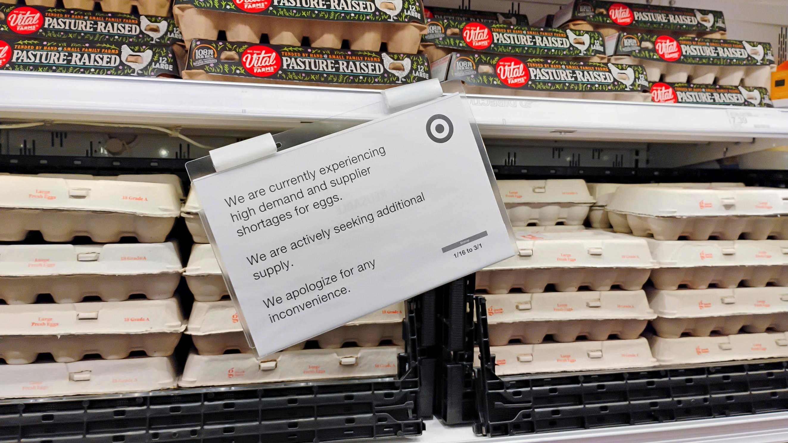 A sign in the egg aisle reads “We are currently experiencing high demand and supplier shortages for eggs. We are actively seeking additional supply. We apologize for any inconvenience.”